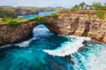 Massive natural rock archway over the ocean at Broken Beach
